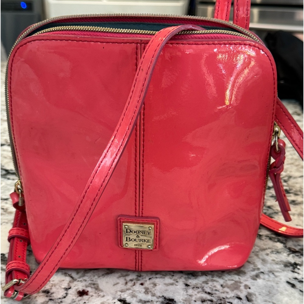 Dooney and Bourke hot pink patent leather crossbody.